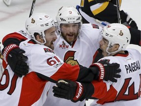Ottawa Senators' Jean-Gabriel Pageau (44) celebrates with teammates Mark Stone (61) and Bobby Ryan (9) after scoring against the Pittsburgh Penguins during the first period of Game 1 of the Eastern Conference final in the NHL hockey Stanley Cup playoffs, Saturday, May 13, 2017, in Pittsburgh.