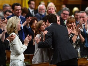 Interim Conservative leader Rona Ambrose and Prime Minister Justin Trudeau embrace during farewell speeches to Ambrose in the House of Commons on Parliament Hill in Ottawa on Tuesday, May 16, 2017.