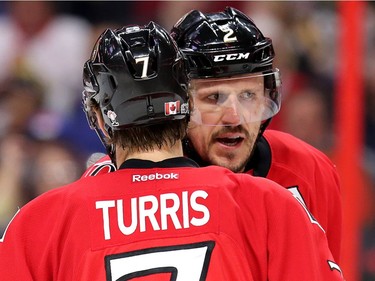 Kyle Turris and Dion Phaneuf confer.