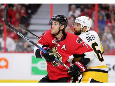 Kyle Turris and Trevor Daley look for the puck in the third period.