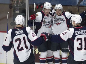 Windsor Spitfires right wing Jeremy Bracco (97) celebrates his goal with teammates centre Logan Brown (21) left wing Graham Knott (37) and defenceman Mikhail Sergachev (31) during third period Memorial Cup round robin hockey action against the Seattle Thunderbirds in Windsor, Ont., on Sunday, May 21, 2017.