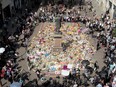 The carpet of floral tributes to the victims and injured of the Manchester Arena bombing covers the ground in St Ann's Square on May 25, 2017 in Manchester, England. This, writes Ahmed Sahi, is not an Islam vs. the West issue, as some have said.