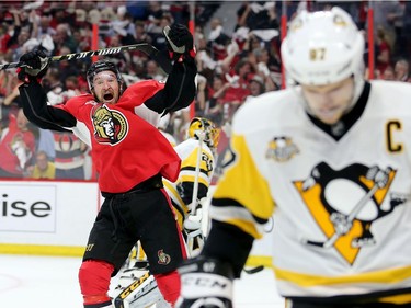 Mark Stone celebrates the 4th Sens goal as Sydney Crosby skates away in the first period as the Ottawa Senators take on the Pittsburgh Penguins in Game 3 of the NHL Eastern Conference Finals at the Canadian Tire Centre.  Wayne Cuddington/Postmedia