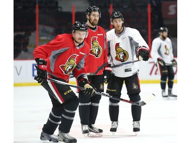Mark Stone  (M) and Kyle Turris (L) of the Ottawa Senators chat during morning practice as Dion Phaneuf  skates off at Canadian Tire Centre in Ottawa, May 12, 2017.