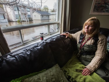 Mary Courneyea at her house on Rue Saint-Patrice in Gatineau which is now unreachable by car. She fears she will lose her home. She just put it up for sale in hopes of retiring to a very small bungalow, but now she fears she has lost everything. As flooding continues throughout the region in areas along the local rivers.