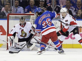 New York Rangers' Mats Zuccarello (36) shoots the puck past Ottawa Senators goalie Craig Anderson (41) and Senators' Ryan Dzingel (18) for a goal during the first period of Game 3 of an NHL hockey Stanley Cup second-round playoff series Tuesday, May 2, 2017, in New York.