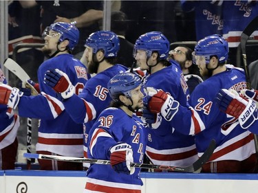 New York Rangers' Mats Zuccarello (36) celebrates with teammates after scoring a goal during the first period of Game 3 of an NHL hockey Stanley Cup second-round playoff series against the Ottawa Senators on Tuesday, May 2, 2017, in New York.
