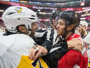 The Penguins' Matt Cullen and the Senators' Kyle Turris chirp each other in the first period.