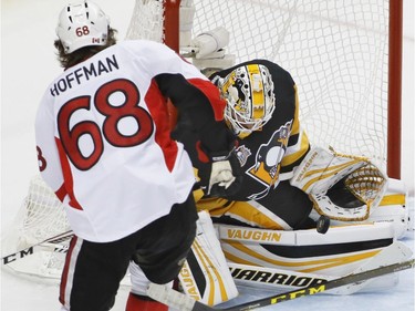 Pittsburgh Penguins' Matt Murray, right, makes a save on Ottawa Senators' Mike Hoffman (68) during the third period of Game 5 in the NHL hockey Stanley Cup Eastern Conference finals, Sunday, May 21, 2017, in Pittsburgh. The Penguins won 7-0.