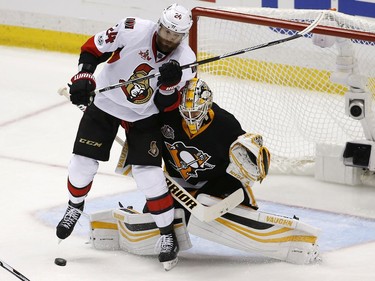 Pittsburgh Penguins goalie Matt Murray (30) blocks a shot as he battles with Ottawa Senators left wing Viktor Stalberg (24) during overtime of Game 7 of the Eastern Conference final in the NHL Stanley Cup hockey playoffs in Pittsburgh, Thursday, May 25, 2017.