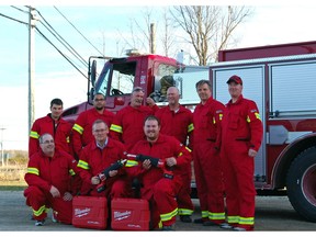 Members of the Gore Bay Fire Department show off the two Milwaukee reciprocating saws used for freeing people trapped in auto wrecks.