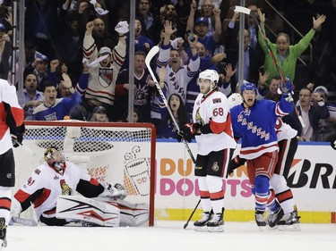 Ottawa Senators goalie Craig Anderson (41) and teammate Mike Hoffman (68) react as New York Rangers' Michael Grabner celebrates his goal during the first period of Game 3 of an NHL hockey Stanley Cup second-round playoff series Tuesday, May 2, 2017, in New York.