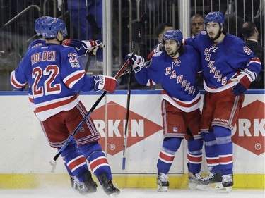 New York Rangers' Mika Zibanejad (93) and Mats Zuccarello (36) celebrate a Zibanejad goal with teammates during the second period of Game 6 of an NHL hockey Stanley Cup second-round playoff series against the Ottawa Senators, Tuesday, May 9, 2017, in New York.