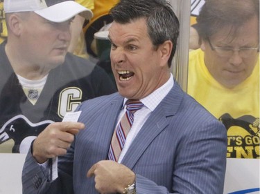 Pittsburgh Penguins head coach Mike Sullivan gives instructions to the team during the first period of Game 2 of the Eastern Conference final in the NHL hockey Stanley Cup playoffs against the Ottawa Senators, Monday, May 15, 2017, in Pittsburgh.