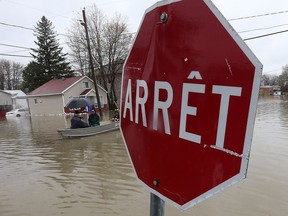 A man and son were rescued after falling from a boat into floodwaters in Gatineau Tuesday night.