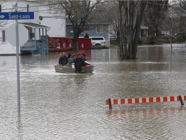 Gatineau emergency workers and neighbours helped the people of Rue Saint-Louis in Gatineau Wednesday May 3, 2017. More rain has caused water to rise and flooded more people out of their homes.
