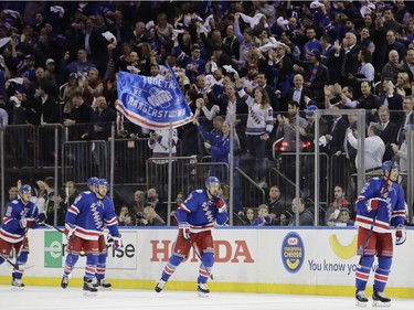 New York Rangers' Nick Holden, right, skates back toward his teams bench after scoring a goal during the first period of Game 4 of an NHL hockey Stanley Cup second-round playoff series against the Ottawa Senators Thursday, May 4, 2017, in New York.