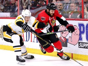 The Penguins' Olli Maatta chases the Senators' Zack Smith in the first period of Game 4.