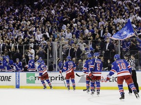 Fans celebrate after New York Rangers' Oscar Lindberg (24) scored a goal during the second period of Game 3 of the team's NHL hockey Stanley Cup second-round playoff series against the Ottawa Senators on Tuesday, May 2, 2017, in New York.