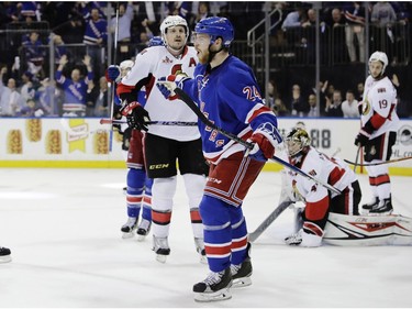 New York Rangers' Oscar Lindberg (24) celebrates after scoring a goal on Ottawa Senators goalie Craig Anderson during the second period of Game 3 of an NHL hockey Stanley Cup second-round playoff series Tuesday, May 2, 2017, in New York.