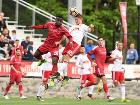 Ottawa Fury FC's Sergio Manesio (No. 28) goes up for a ball against the New York Red Bulls II in New Jersey on Saturday, May 20, 2017.