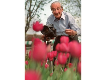 Ottawa photographer Malak, takes aim at a bed of tulips near the canal