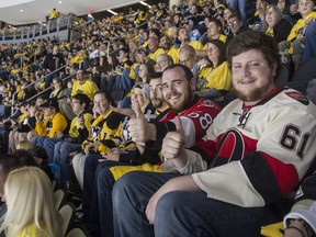 Ottawa Senators fans Kevin Richardson and Eric Brown were specks of red in a sea of black and gold at Game 1 of the Eastern Conference finals Saturday night. (Bruce Deachman, Ottawa Citizen)