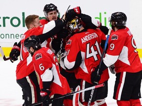 Ottawa Senators goalie Craig Anderson is congratulated by his teammates on Saturday, May 6, 2017 after another dramatic overtime win over the Rangers.