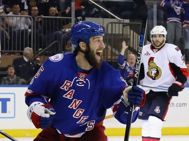 Tanner Glass #15 of the New York Rangers celebrates a goal by Oscar Lindberg #24 at 15:54 of the second period against the Ottawa Senators  in Game Four of the Eastern Conference Second Round during the 2017 NHL Stanley Cup Playoffs at Madison Square Garden on May 4, 2017 in New York City.