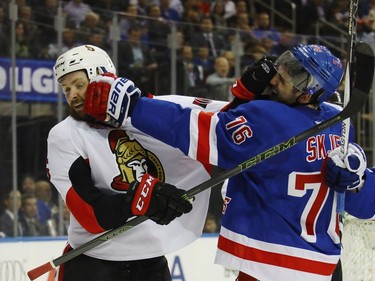 Zack Smith #15 of the Ottawa Senators and Brady Skjei #76 of the New York Rangers battle during the first period in Game Four of the Eastern Conference Second Round during the 2017 NHL Stanley Cup Playoffs at Madison Square Garden on May 4, 2017 in New York City.