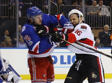 Clarke MacArthur #16 of the Ottawa Senators and Brady Skjei #76 of the New York Rangers battle during the first period in Game Four of the Eastern Conference Second Round during the 2017 NHL Stanley Cup Playoffs at Madison Square Garden on May 4, 2017 in New York City.