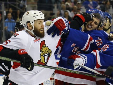 Zack Smith #15 of the Ottawa Senators and Brady Skjei #76 of the New York Rangers battle during the first period in Game Four of the Eastern Conference Second Round during the 2017 NHL Stanley Cup Playoffs at Madison Square Garden on May 4, 2017 in New York City.