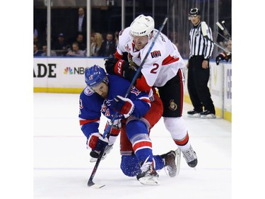 Dion Phaneuf #2 of the Ottawa Senators hits Kevin Hayes #13 of the New York Rangers during the first period in Game Four of the Eastern Conference Second Round during the 2017 NHL Stanley Cup Playoffs at Madison Square Garden on May 4, 2017 in New York City.
