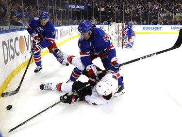 NEW YORK, NY - MAY 09:  Brendan Smith #42 of the New York Rangers checks Alex Burrows #14 of the Ottawa Senators to the ice during the first period in Game Six of the Eastern Conference Second Round during the 2017 NHL Stanley Cup Playoffs at Madison Square Garden on May 9, 2017 in New York City.