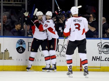 NEW YORK, NY - MAY 09:  Erik Karlsson #65 of the Ottawa Senators celebrates with teammates Derick Brassard #19 and Marc Methot #3 after scoring a goal against Henrik Lundqvist #30 of the New York Rangers during the second period in Game Six of the Eastern Conference Second Round during the 2017 NHL Stanley Cup Playoffs at Madison Square Garden on May 9, 2017 in New York City.