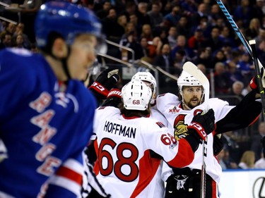 NEW YORK, NY - MAY 09:  Mike Hoffman #68 of the Ottawa Senators celebrates with teammates Clarke MacArthur #16 and Erik Karlsson #65 after scoring a goal against Henrik Lundqvist #30 of the New York Rangers during the first period in Game Six of the Eastern Conference Second Round during the 2017 NHL Stanley Cup Playoffs at Madison Square Garden on May 9, 2017 in New York City.