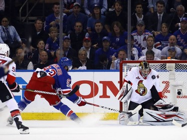 Craig Anderson of the Ottawa Senators makes the first period save on Mika Zibanejad #93 of the New York Rangers in Game Three of the Eastern Conference Second Round during the 2017 NHL Stanley Cup Playoffs at Madison Square Garden on May 2, 2017 in New York City.