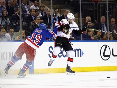 NEW YORK, NY - MAY 02:  Derick Brassard #19 of the Ottawa Senators is checked by Jesper Fast #19 of the New York Rangers during the first period in Game Three of the Eastern Conference Second Round during the 2017 NHL Stanley Cup Playoffs at Madison Square Garden on May 2, 2017 in New York City.