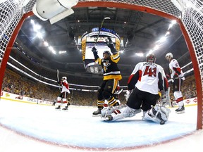 PITTSBURGH, PA - MAY 21:  Nick Bonino #13 celebrates a goal scored by Olli Maatta #3 of the Pittsburgh Penguinsl against Craig Anderson #41 of the Ottawa Senators during the first period in Game Five of the Eastern Conference Final during the 2017 NHL Stanley Cup Playoffs at PPG PAINTS Arena on May 21, 2017 in Pittsburgh, Pennsylvania.