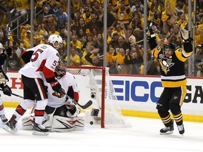 Sidney Crosby of the Pittsburgh Penguins celebrates with his teammates after scoring a goal against Craig Anderson of the Ottawa Senators during the first period in Game Fiveon May 21, 2017 in Pittsburgh, Pennsylvania.