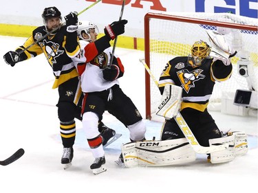 Marc-André Fleury makes a glove save.