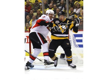 Dion Phaneuf makes life uncomfortable for Sidney Crosby.