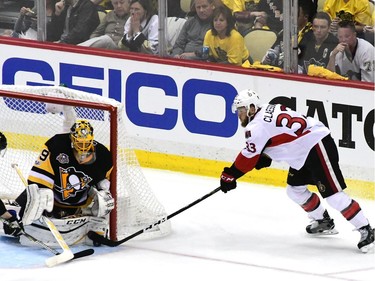 Marc-André Fleury makes a save against Fredrik Claesson.