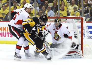 Matt Cullen of the Pittsburgh Penguins takes a shot on Craig Anderson in the first period.