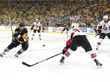 Matt Cullen #7 of the Pittsburgh Penguins looks for the puck against Fredrik Claesson #33 of the Ottawa Senators during the first period in Game Seven of the Eastern Conference Final during the 2017 NHL Stanley Cup Playoffs at PPG PAINTS Arena on May 25, 2017 in Pittsburgh, Pennsylvania.