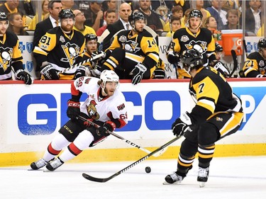 Mike Hoffman #68 of the Ottawa Senators skates with the puck against Matt Cullen #7 of the Pittsburgh Penguins during the first period in Game Seven of the Eastern Conference Final during the 2017 NHL Stanley Cup Playoffs at PPG PAINTS Arena on May 25, 2017 in Pittsburgh, Pennsylvania.