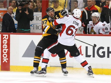 Sidney Crosby #87 of the Pittsburgh Penguins collides with Mark Stone #61 of the Ottawa Senators during the first period in Game Seven of the Eastern Conference Final during the 2017 NHL Stanley Cup Playoffs at PPG PAINTS Arena on May 25, 2017 in Pittsburgh, Pennsylvania.