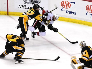 PITTSBURGH, PA - MAY 25:  Clarke MacArthur #16 of the Ottawa Senators falls to the ice against Carter Rowney #37 of the Pittsburgh Penguins during the third period in Game Seven of the Eastern Conference Final during the 2017 NHL Stanley Cup Playoffs at PPG PAINTS Arena on May 25, 2017 in Pittsburgh, Pennsylvania.