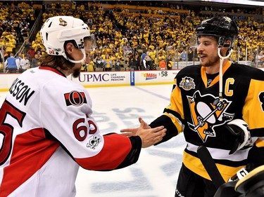 PITTSBURGH, PA - MAY 25:  (L-R) Erik Karlsson #65 of the Ottawa Senators congratulates Sidney Crosby #87 of the Pittsburgh Penguins after winning Game Seven of the Eastern Conference Final during the 2017 NHL Stanley Cup Playoffs at PPG PAINTS Arena on May 25, 2017 in Pittsburgh, Pennsylvania.