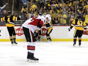 Viktor Stalberg #24 of the Ottawa Senators reacts as Chris Kunitz #14 of the Pittsburgh Penguins celebrates with Sidney Crosby #87, Ian Cole #28, Justin Schultz #4 and Conor Sheary #43 after scoring the game winning goal agianst Craig Anderson in the second overtime with a score of 3-2 in Game Seven to win the Eastern Conference Final on May 25, 2017 in Pittsburgh, Pennsylvania.